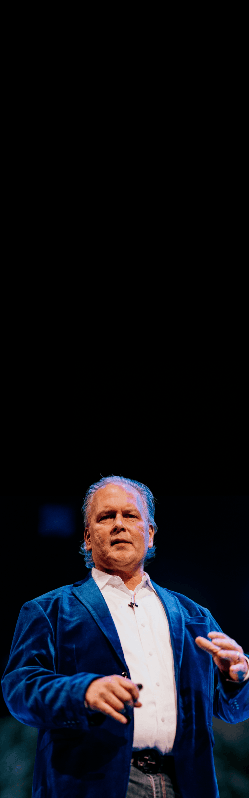 Brian Moses speaking on stage