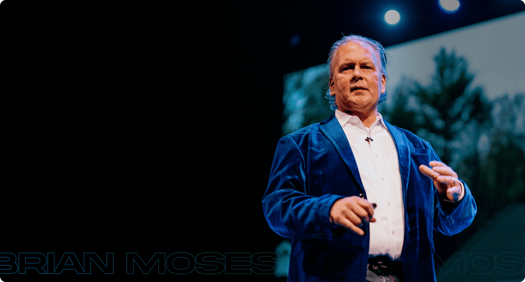 Brian Moses speaking on stage